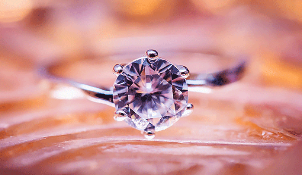 gold chain bracelet sits on magazine