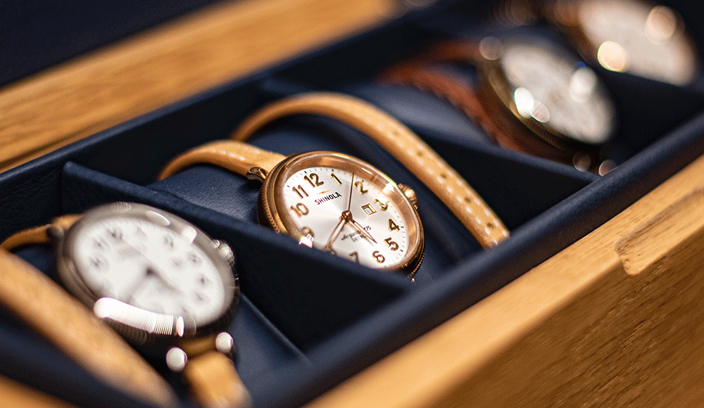 a set of watches sit in a case